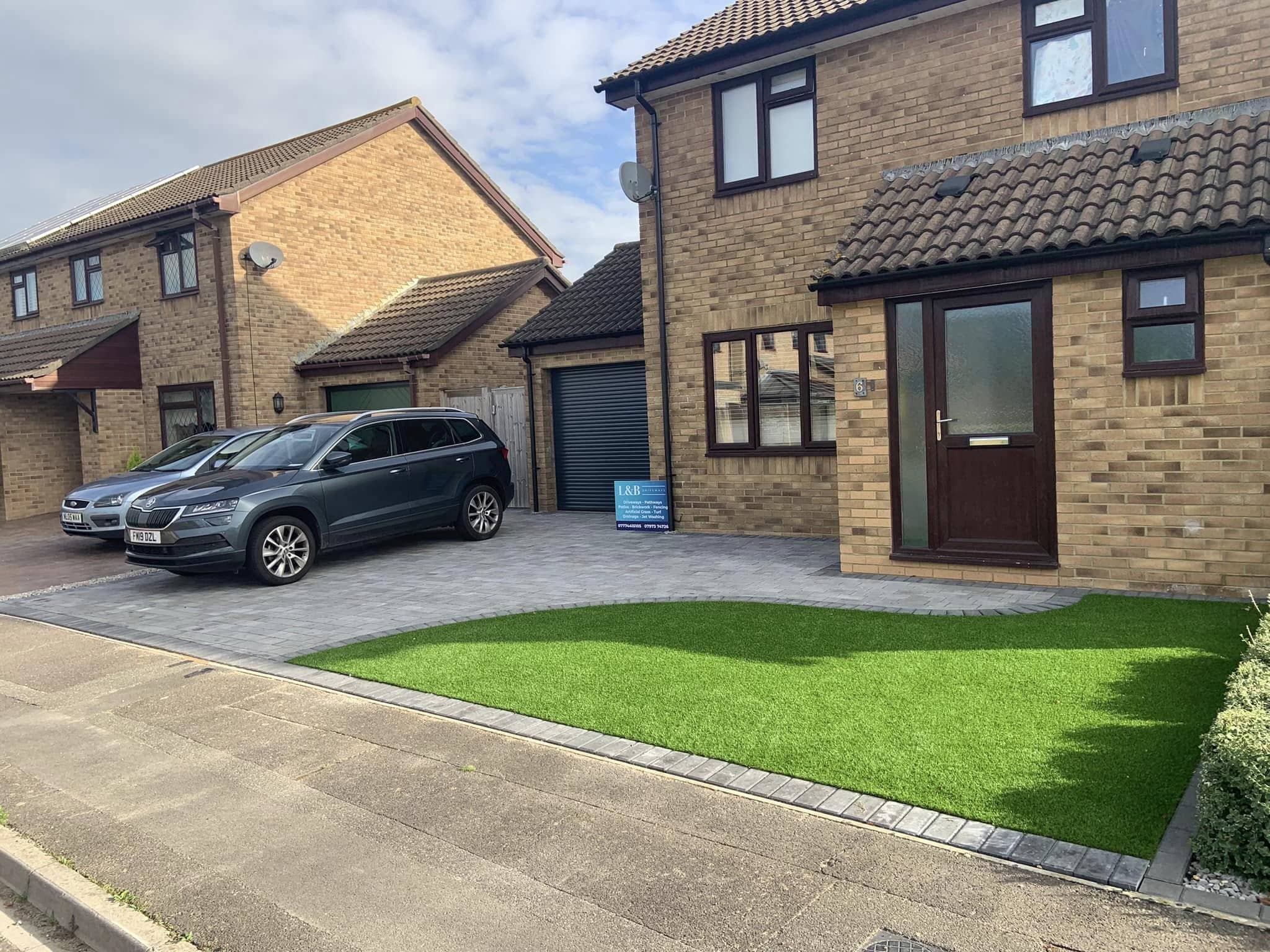 New blocked paved driveway and lawn for a residential property