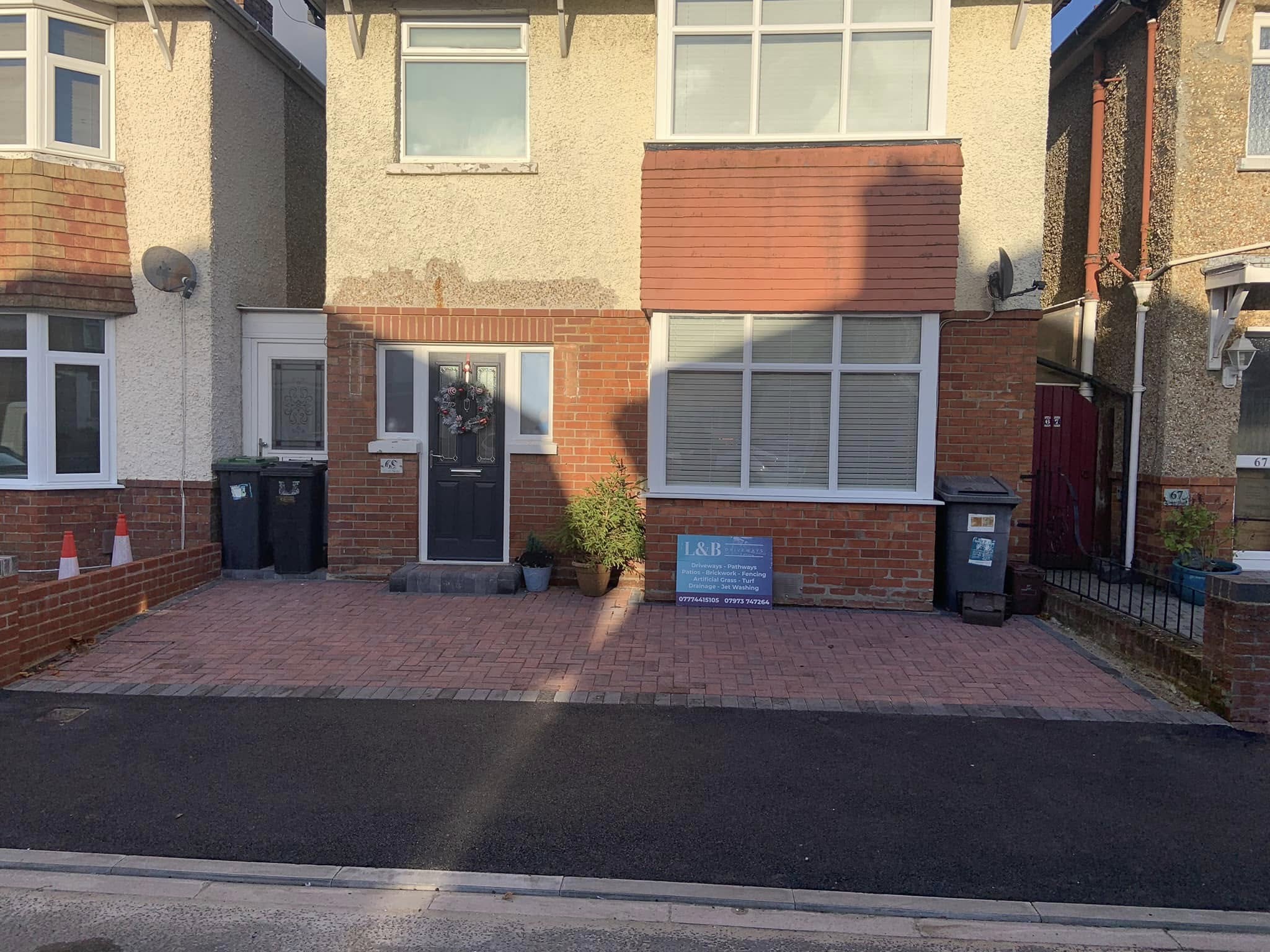 Front garden converted into paved driveway space of residential home