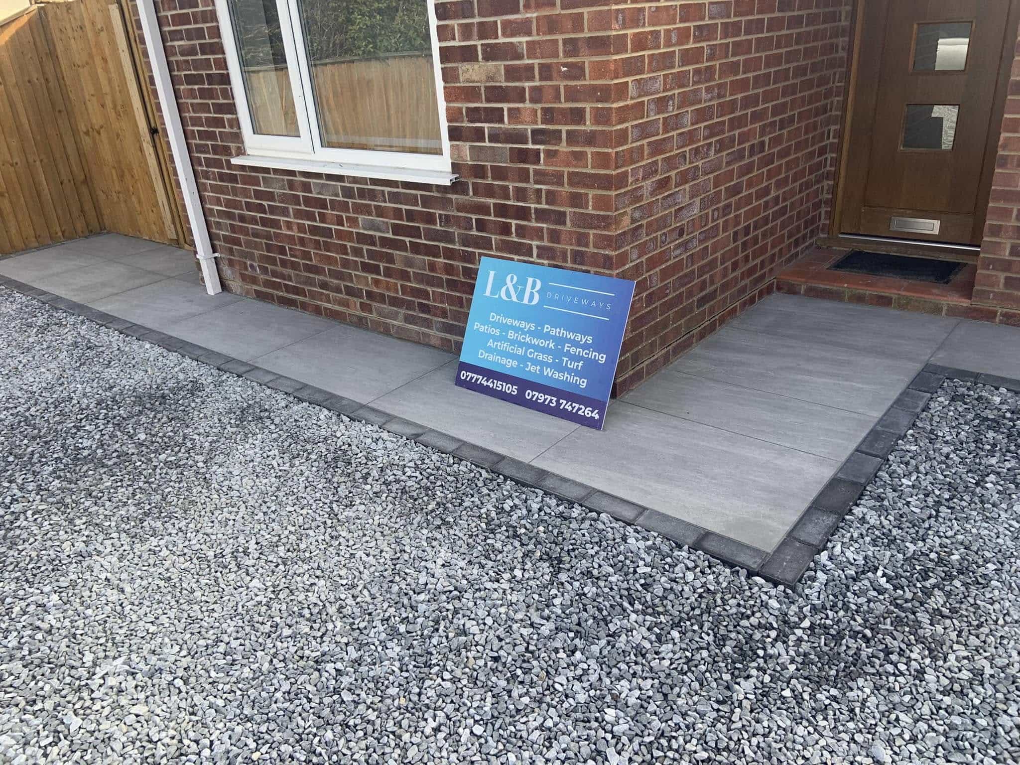 Natural stone driveway combined with tile walkway
