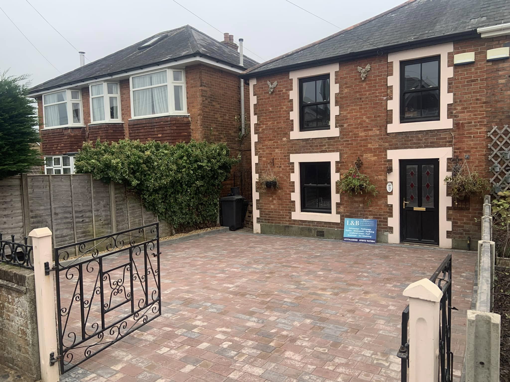 Large driveway with mixed paving patterns